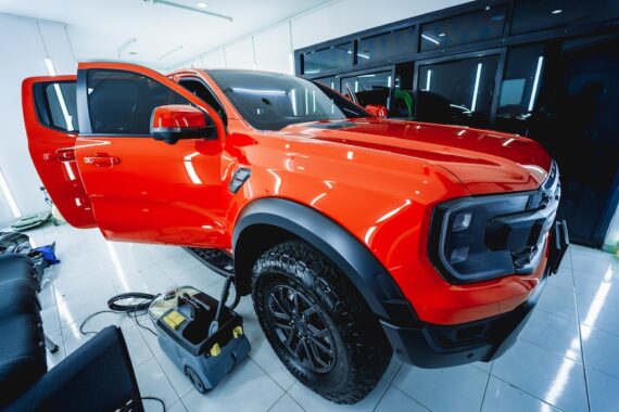 Replacing spare parts on a disassembled car in a car service garage
